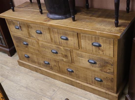 A modern oak chest of nine drawers W.152cm